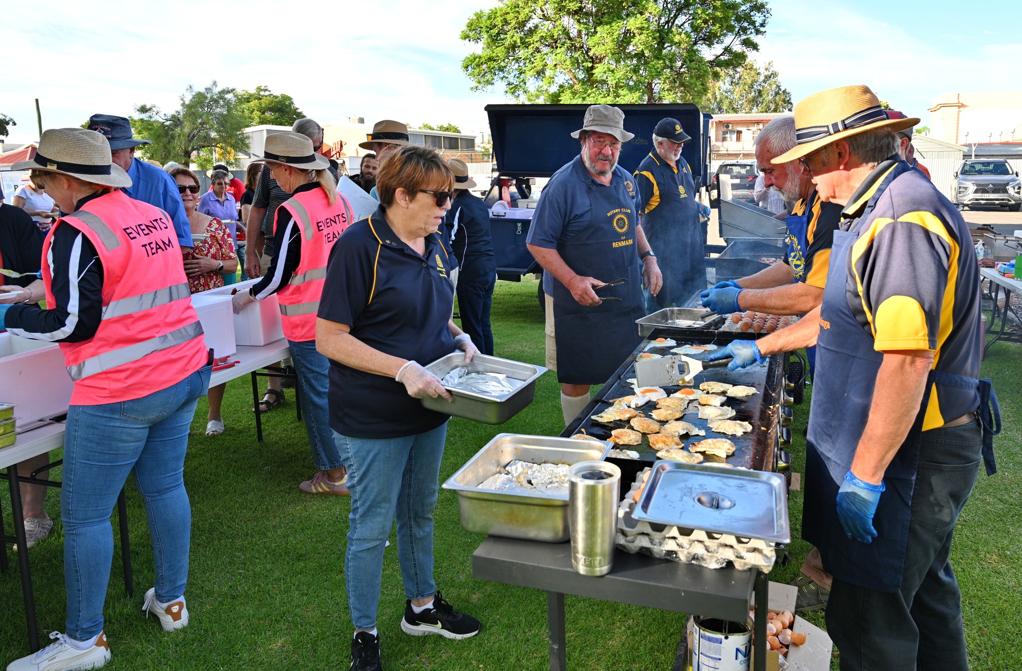 Cooking Barbecue and serving food at event